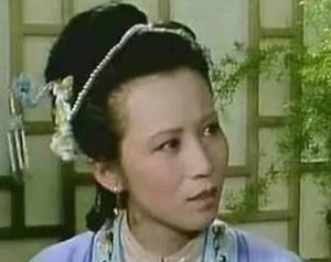 红楼梦中在螃蟹宴上李纨做了什么事情？她为何要摸平儿